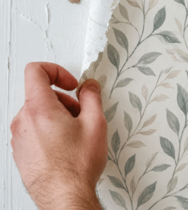 TrueHue painter finishing an interior wall in Milton Keynes